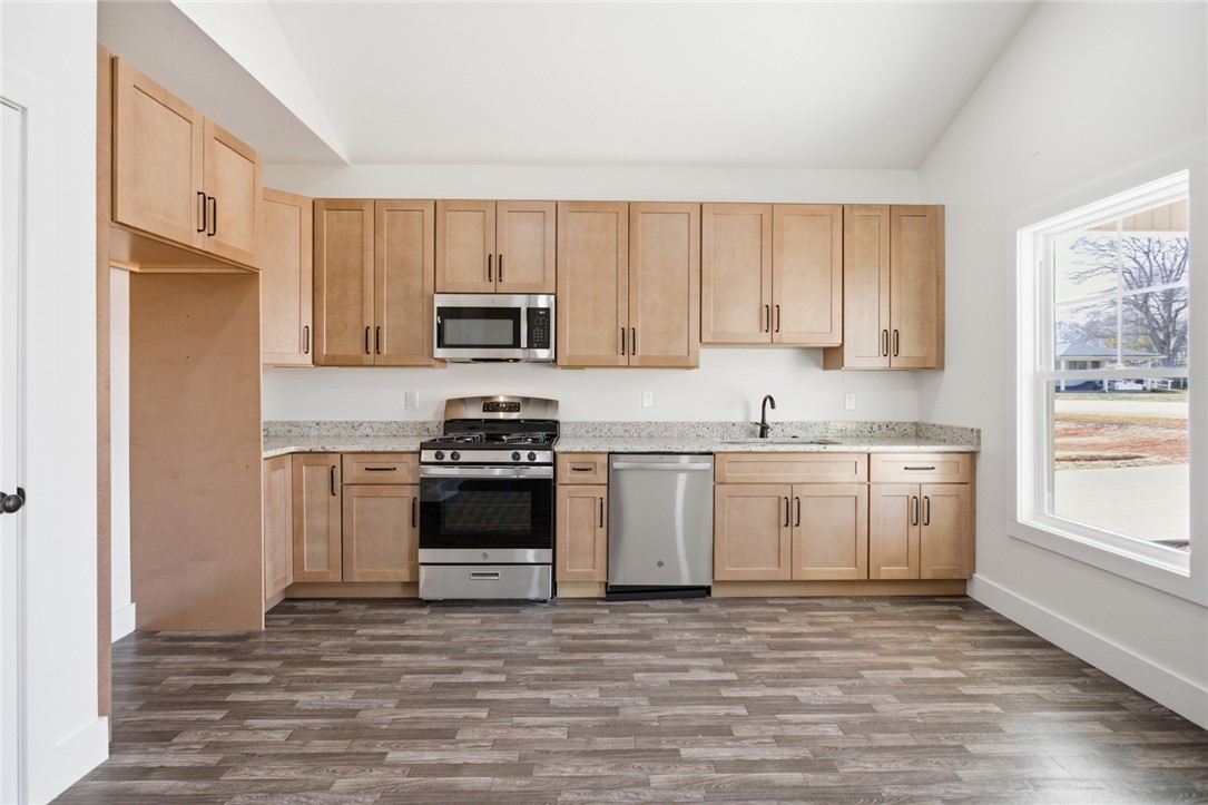 115 Riley Street Westminster, SC 29693 - Photo 3 of 46 This spacious kitchen offers ample cabinetry, modern appliances, and a beautiful view from the window.