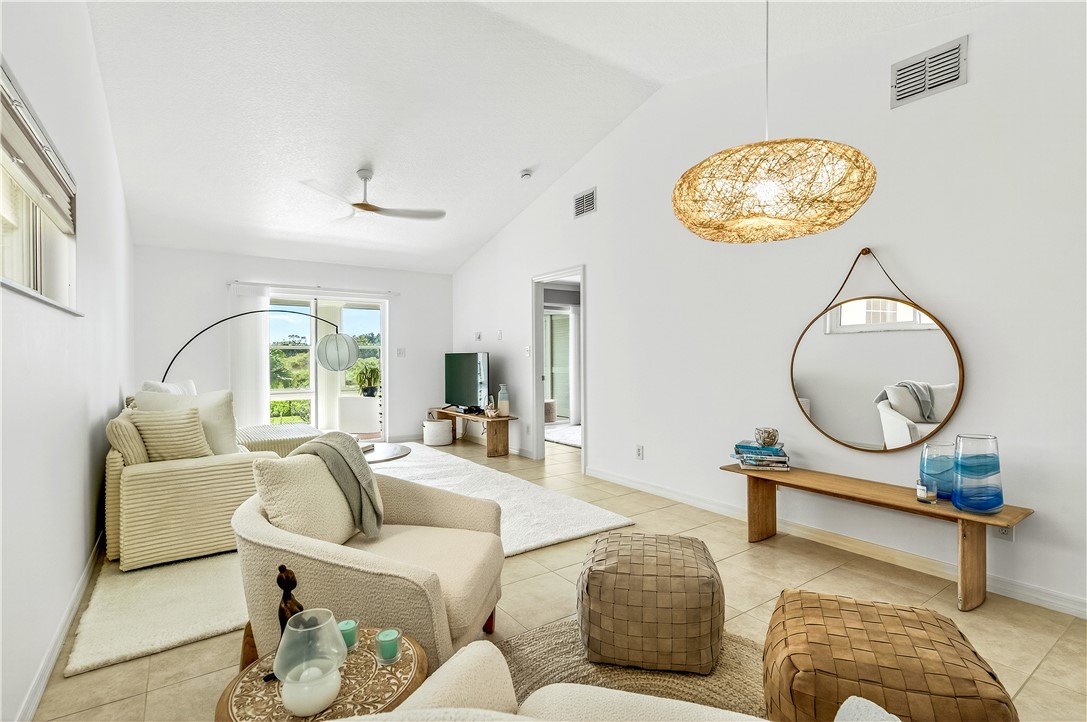 475 Grove Isle Circle, Unit 475 Vero Beach, FL 32962 - Photo 12 of 36 a living room with furniture
