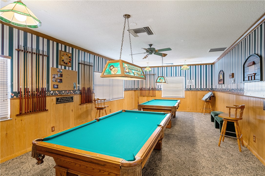 475 Grove Isle Circle, Unit 475 Vero Beach, FL 32962 - Photo 25 of 36 a room with pool table and windows