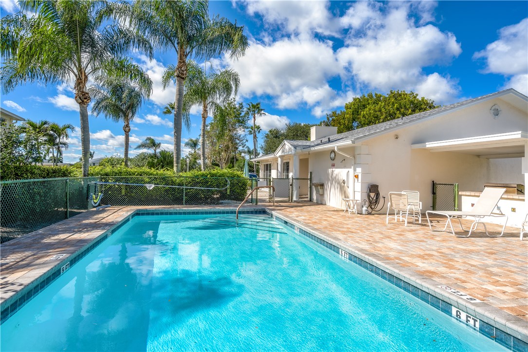 475 Grove Isle Circle, Unit 475 Vero Beach, FL 32962 - Photo 29 of 36 a view of a house with a yard