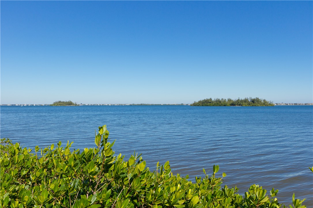 475 Grove Isle Circle, Unit 475 Vero Beach, FL 32962 - Photo 36 of 36 a view of a lake from a yard
