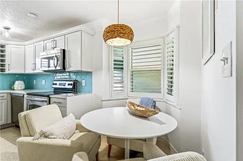 a living room with furniture a window and a fireplace