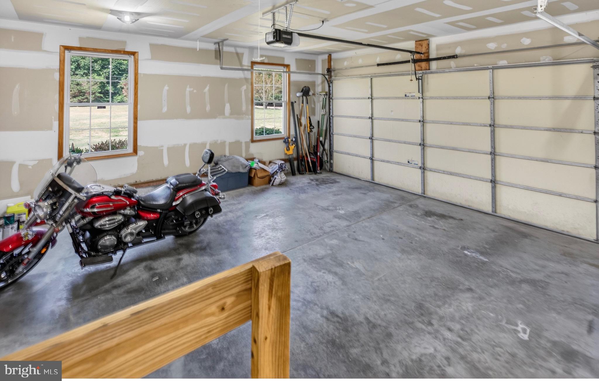 18315 Atlanta Road Bridgeville, DE 19933 - Photo 22 of 28 a view of a garage with a bike and a window