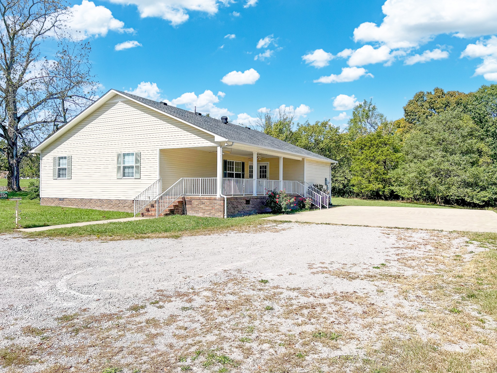 1235 Yell Road Lewisburg, TN 37091 - Photo 2 of 36 a view of a house with a backyard and a tree