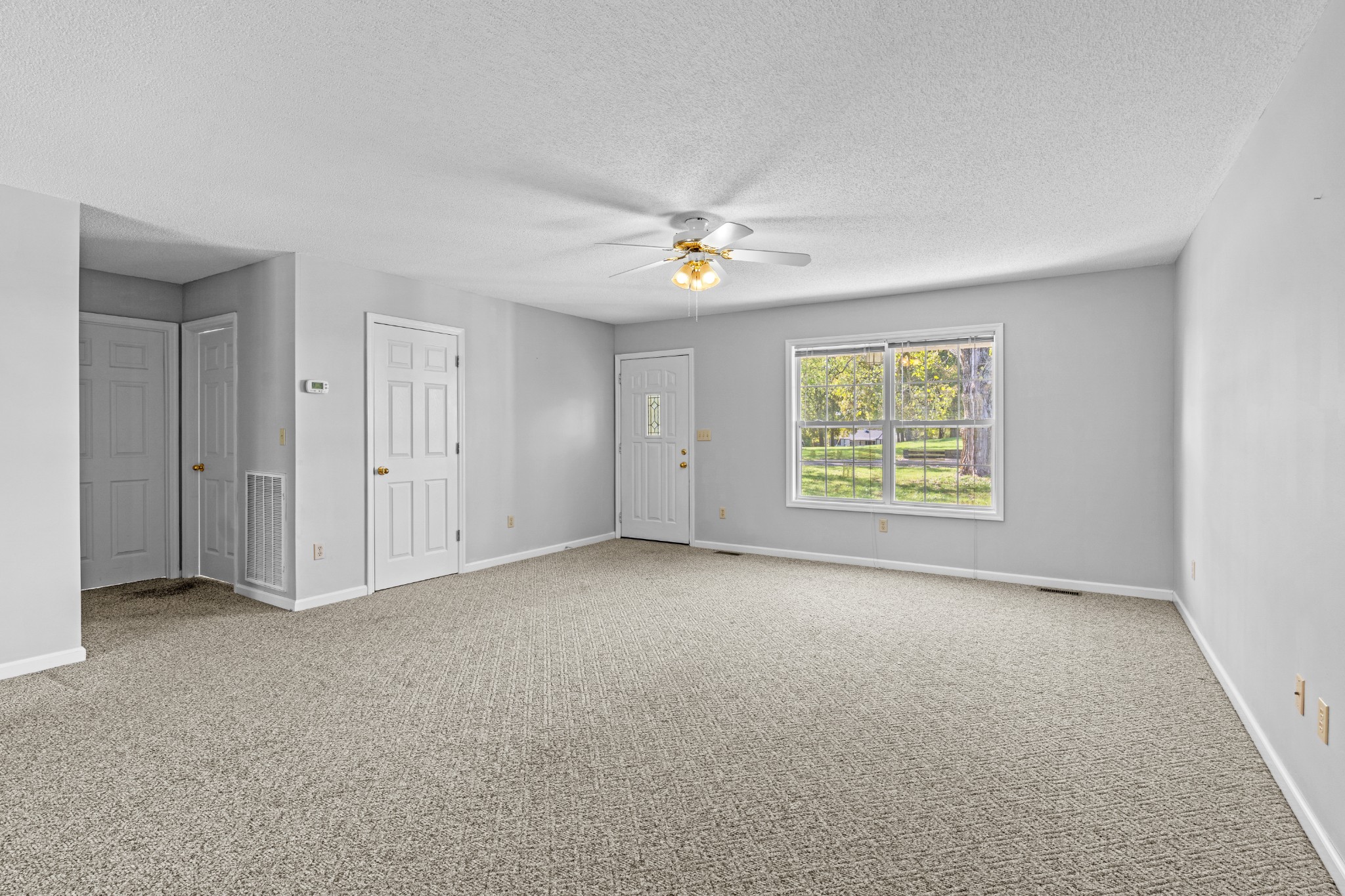 1235 Yell Road Lewisburg, TN 37091 - Photo 23 of 36 an empty room with a ceiling fan and a window