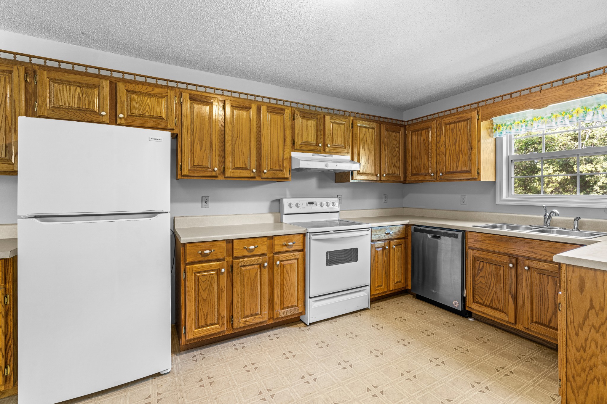 1235 Yell Road Lewisburg, TN 37091 - Photo 28 of 36 a kitchen with stainless steel appliances granite countertop a refrigerator sink and cabinets