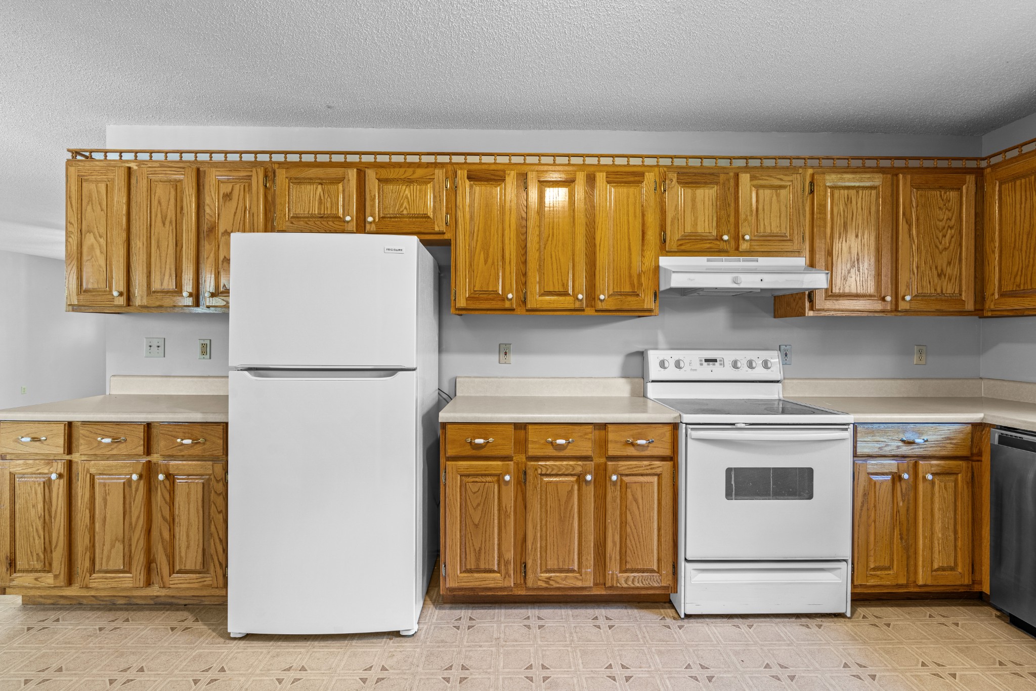 1235 Yell Road Lewisburg, TN 37091 - Photo 29 of 36 a kitchen with a refrigerator sink stove and cabinets
