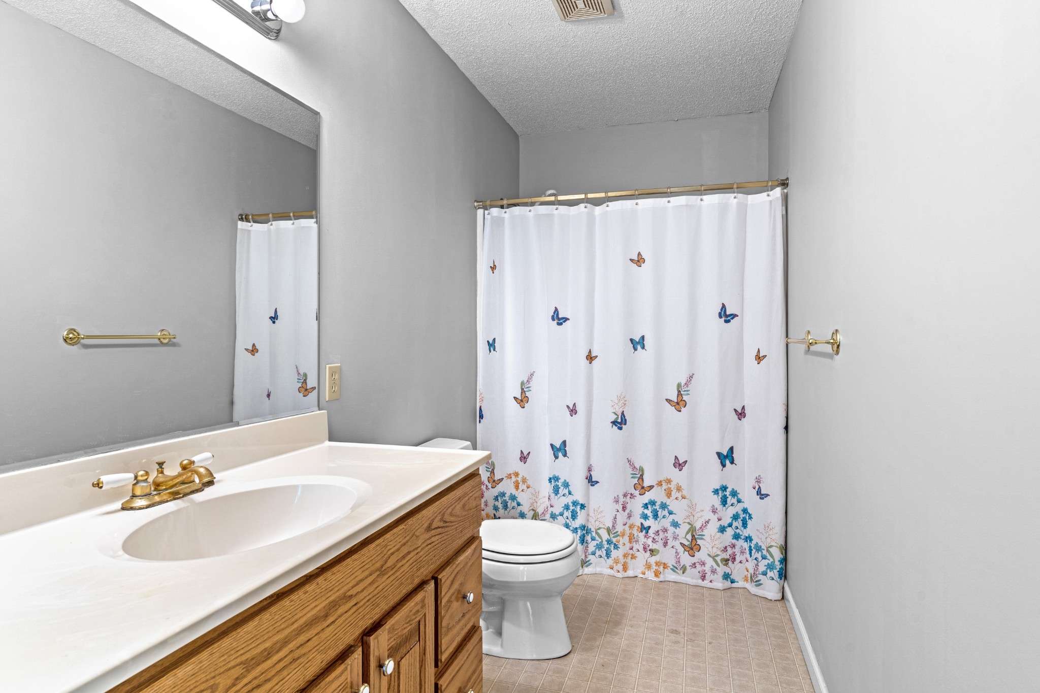 1235 Yell Road Lewisburg, TN 37091 - Photo 36 of 36 a bathroom with a sink a toilet and shower curtain