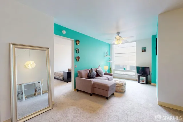 a living room with furniture and a table