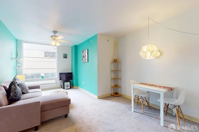 a living room with furniture and a window