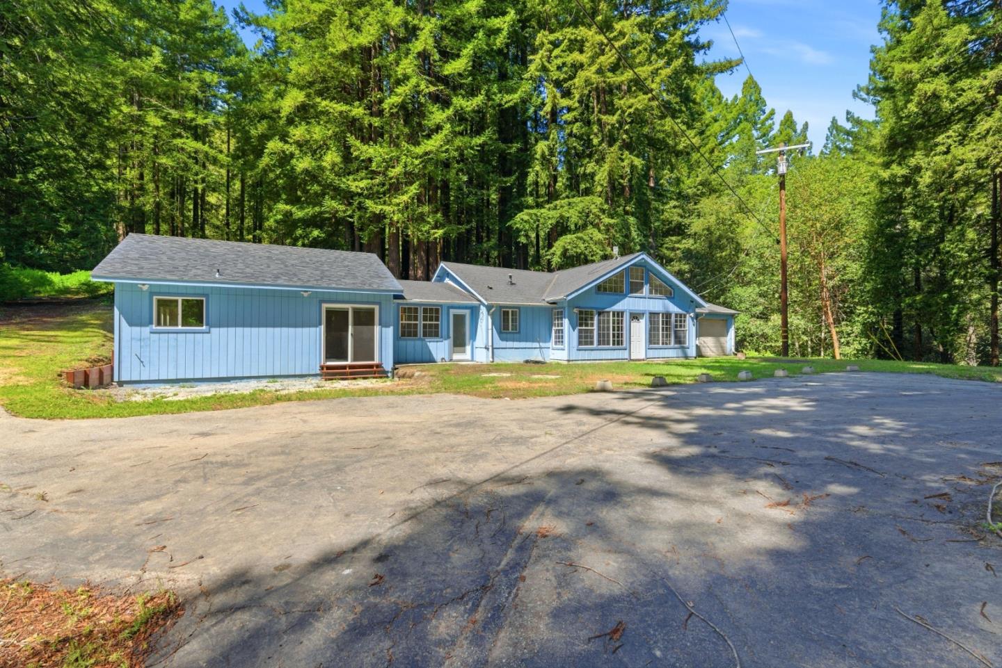 1460 Tucker Road Scotts Valley, CA 95066 - Photo 2 of 32 a house with swimming pool in front of it
