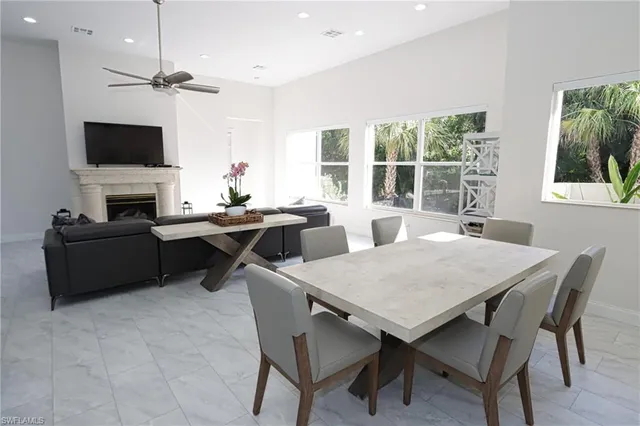 a view of a dining room with furniture window and outside view