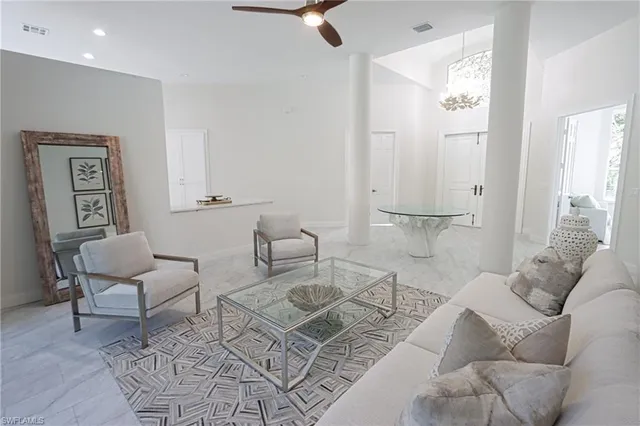 a living room with furniture and a rug