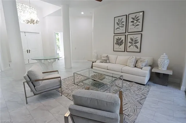 a living room with furniture and a rug
