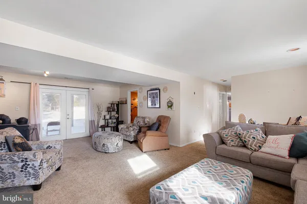 a living room with furniture window and a couch