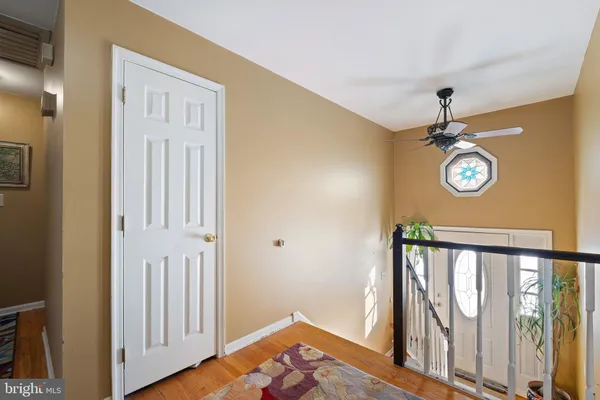 a view of an entryway with wooden floor