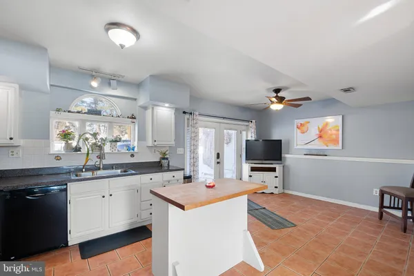 a kitchen with a sink stove and refrigerator