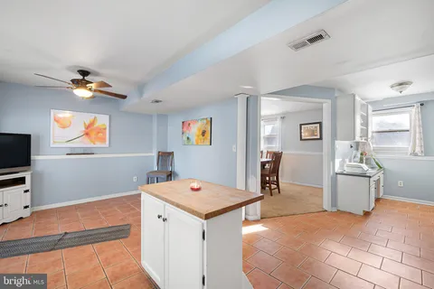 a view of kitchen with microwave and furniture
