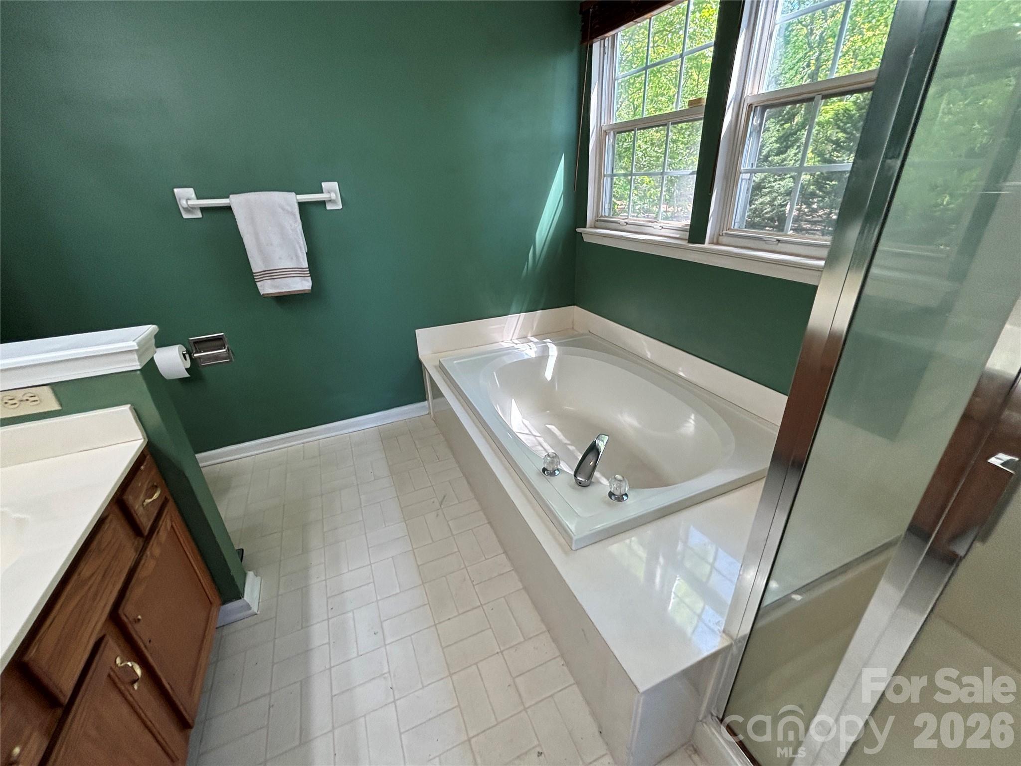 2601 Yarrow Road Charlotte, NC 28213 - Photo 25 of 40 a bathroom with a sink a mirror and a window