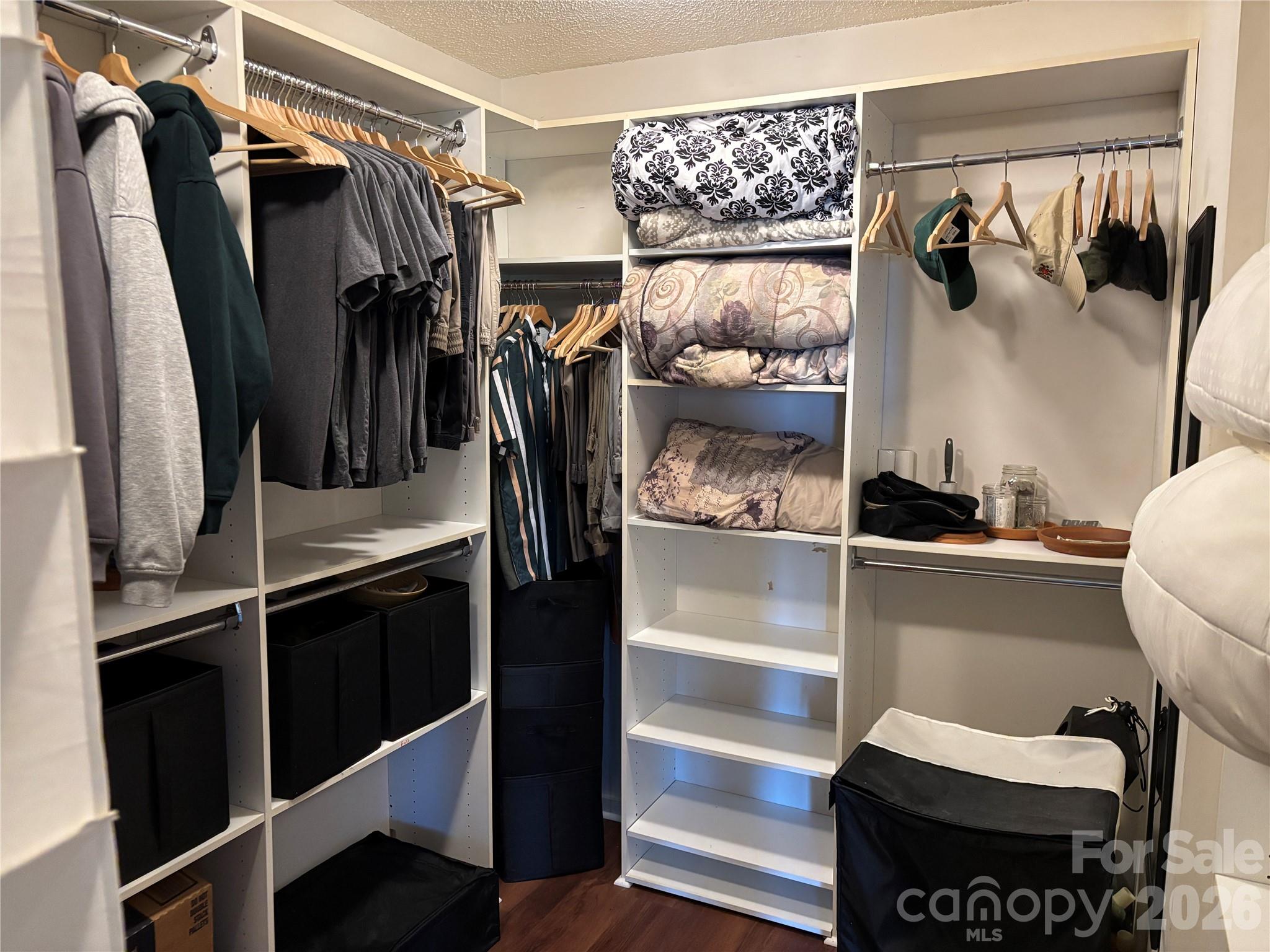 2601 Yarrow Road Charlotte, NC 28213 - Photo 27 of 40 a view of walk in closet with clothes and shoes
