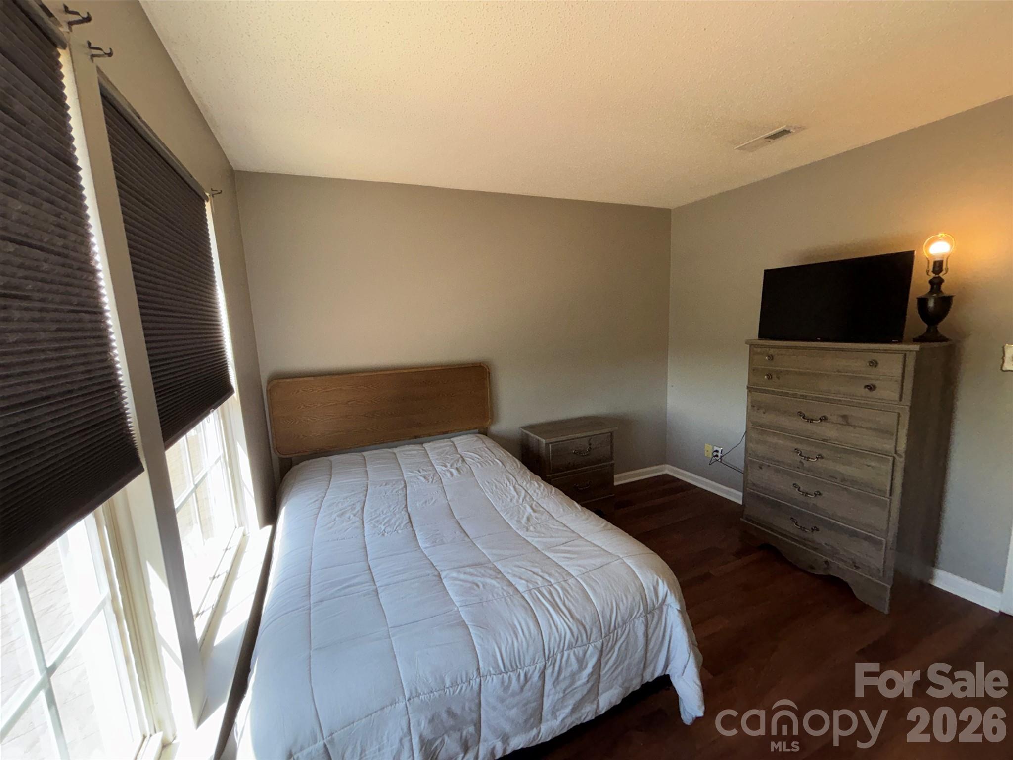 2601 Yarrow Road Charlotte, NC 28213 - Photo 28 of 40 a bedroom with a bed and a flat screen tv
