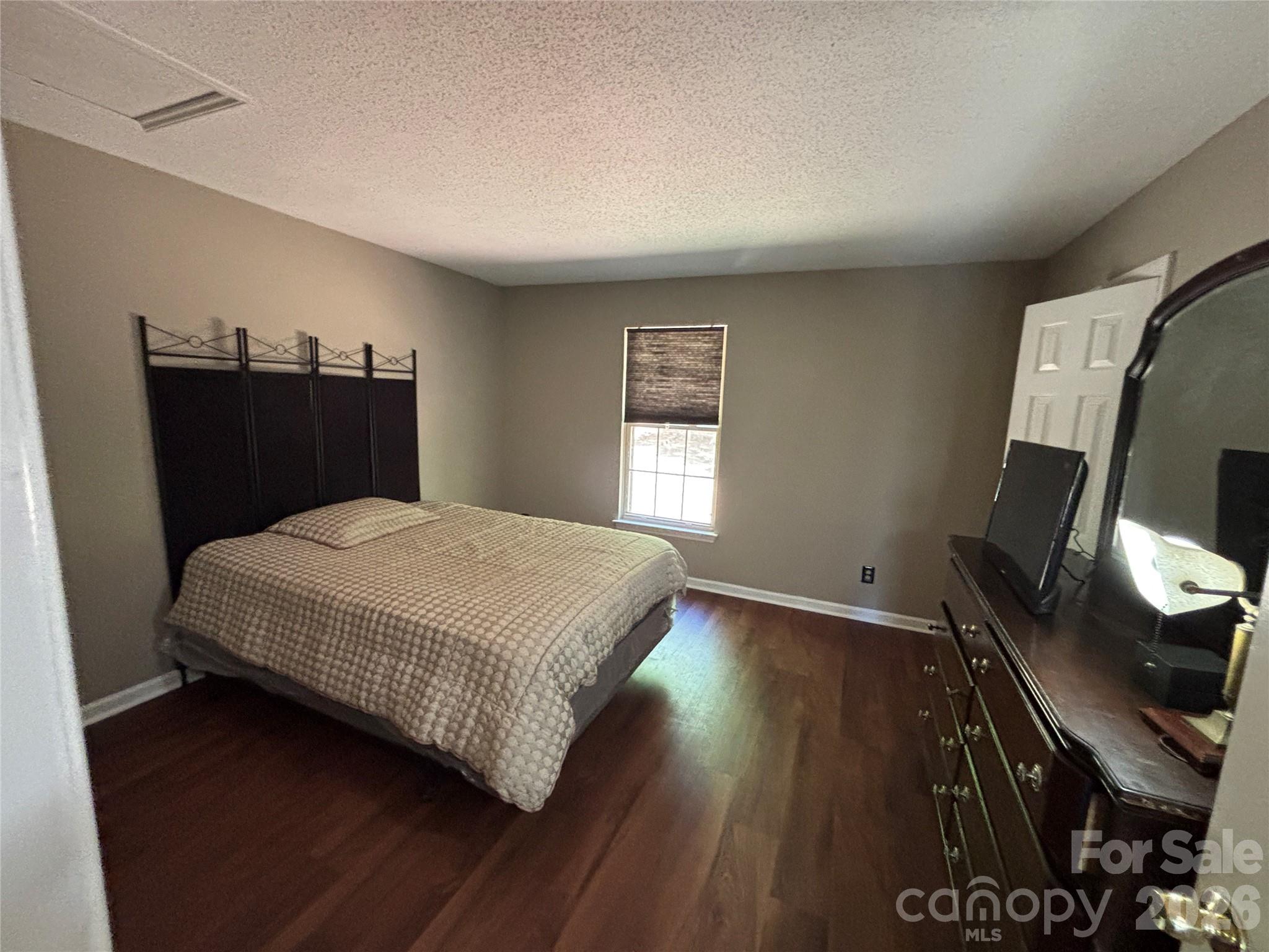 2601 Yarrow Road Charlotte, NC 28213 - Photo 31 of 40 a bedroom with a bed and dresser