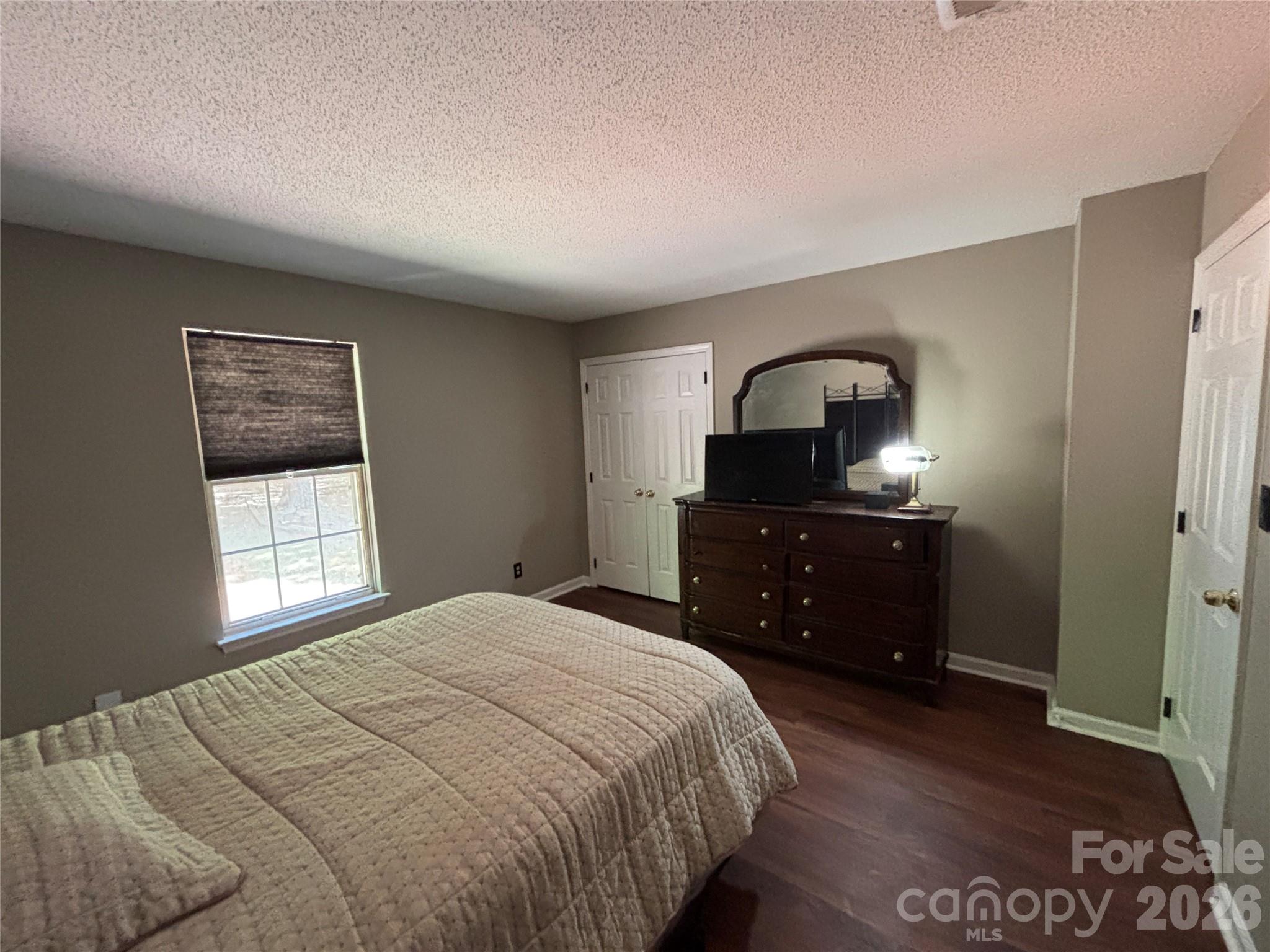 2601 Yarrow Road Charlotte, NC 28213 - Photo 32 of 40 a bedroom with a bed and a dresser