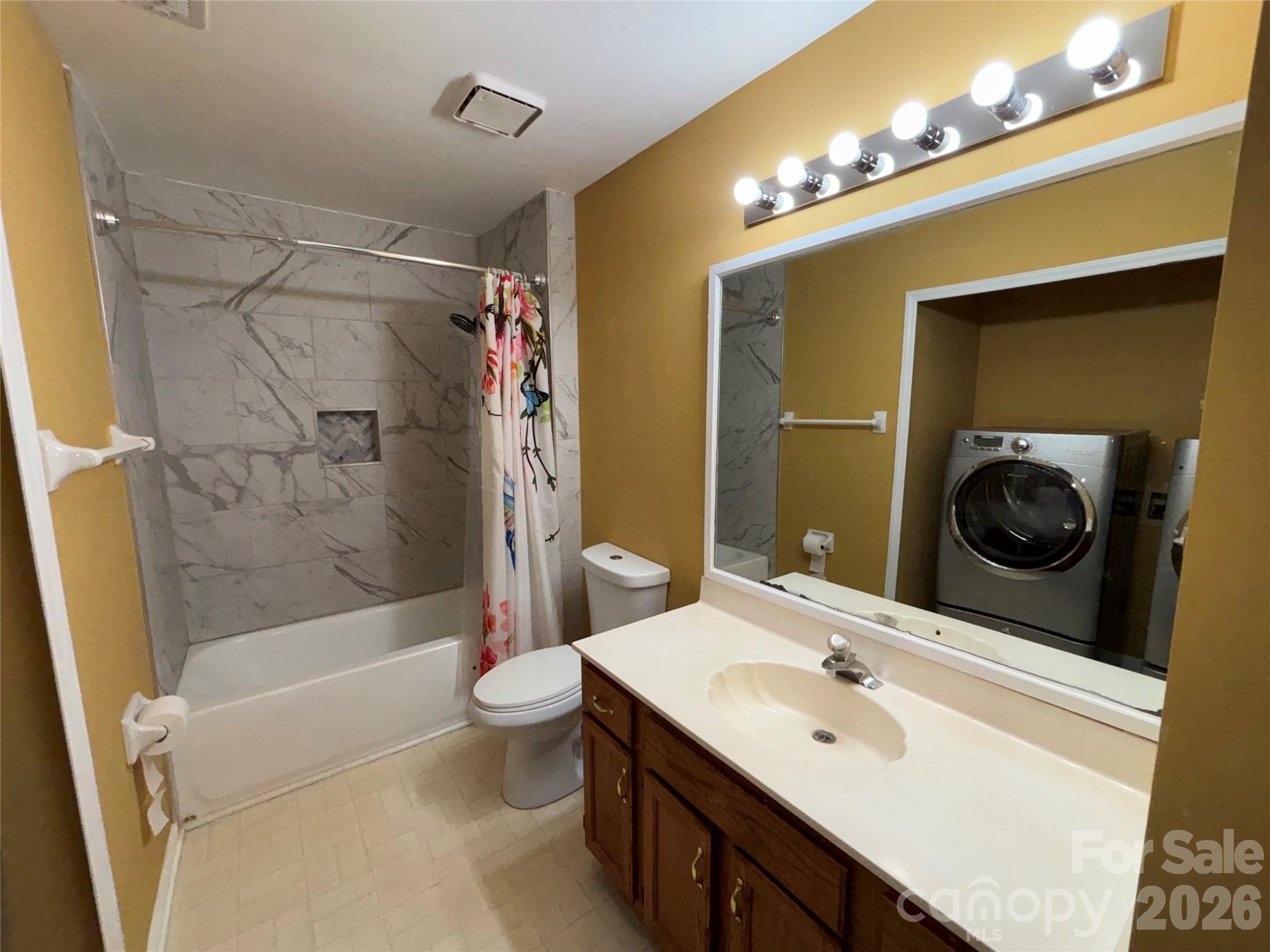 2601 Yarrow Road Charlotte, NC 28213 - Photo 34 of 40 a bathroom with a sink a toilet and shower