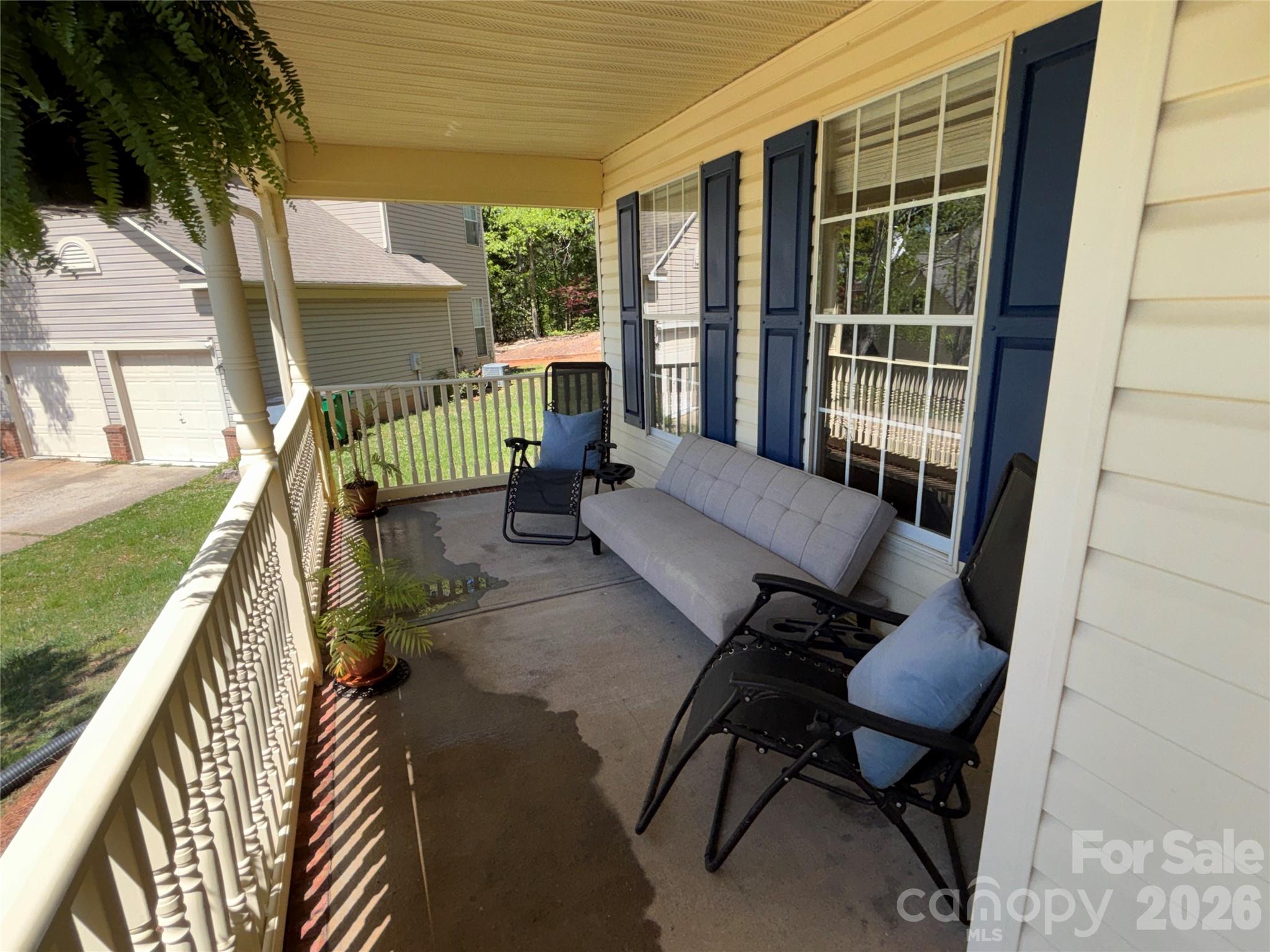 2601 Yarrow Road Charlotte, NC 28213 - Photo 4 of 40 a balcony with furniture and a potted plant