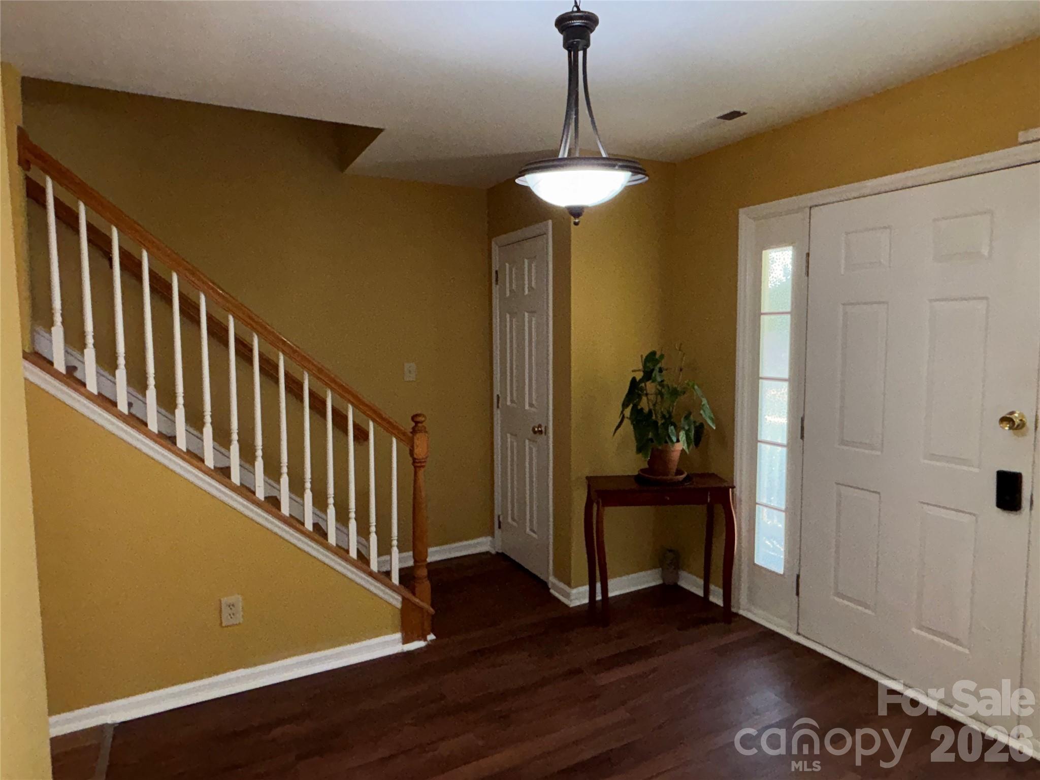 2601 Yarrow Road Charlotte, NC 28213 - Photo 5 of 40 a view of a hallway with wooden floor and staircase