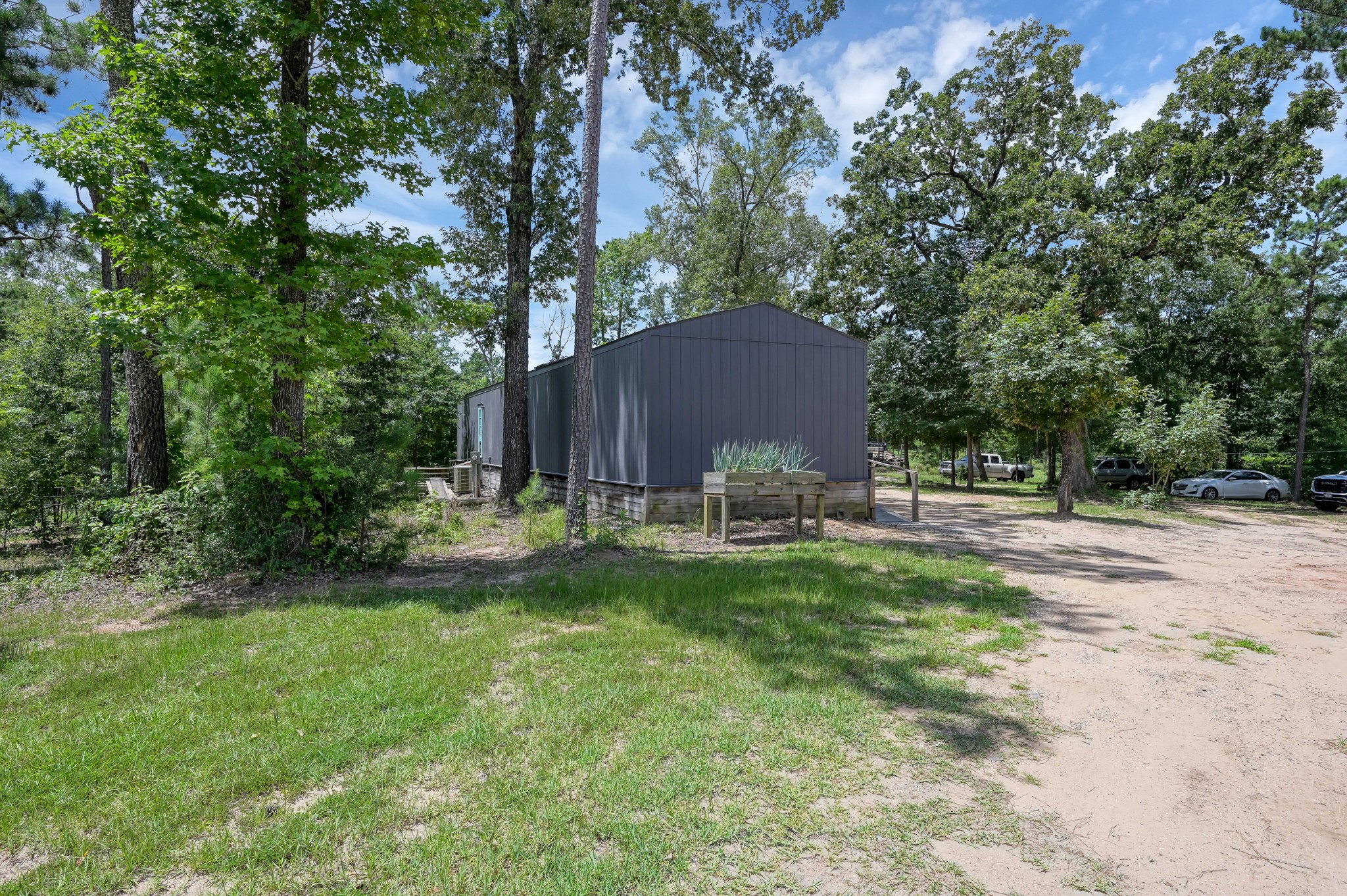400 Raven Hill Road Oakhurst, TX 77359 - Photo 34 of 45 a view of backyard with kitchen