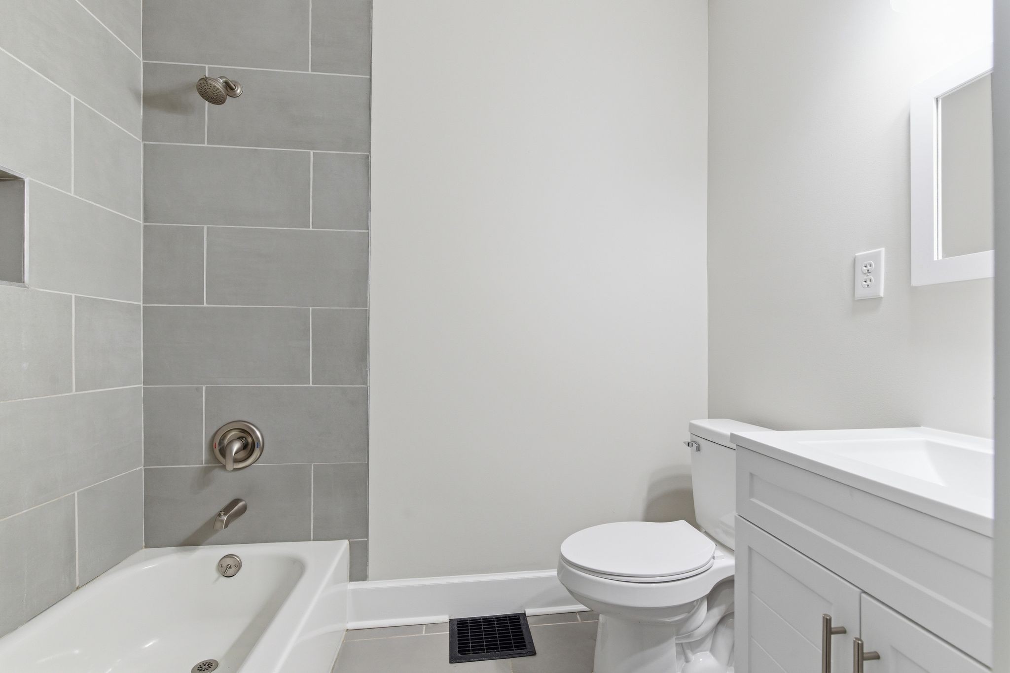 305 South Irwin Street Manchester, TN 37355 - Photo 24 of 40 a white toilet sitting next to a bath tub and a shower