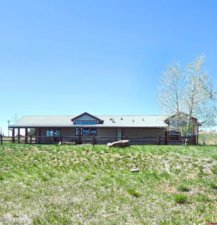 a view of a kitchen with a sink and windows