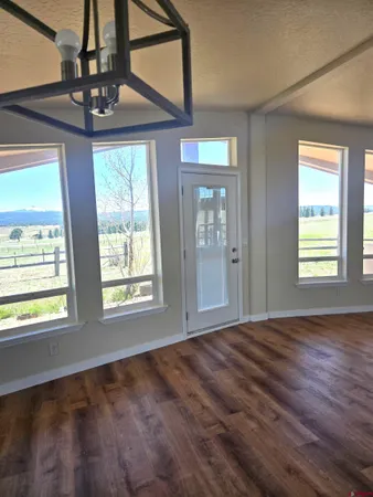 a view of empty room with windows