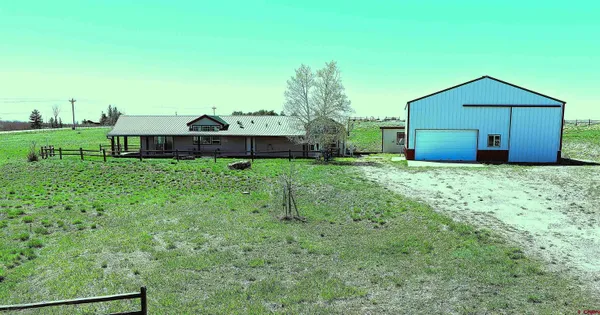 a view of a back yard of the house