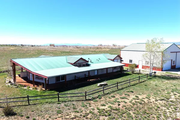 a front view of a house with a swimming pool
