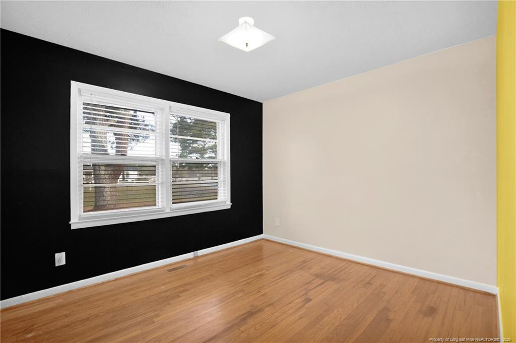 623 Isaac Weeks Road Clinton, NC 28328 - Photo 14 of 24 a view of an empty room with a window