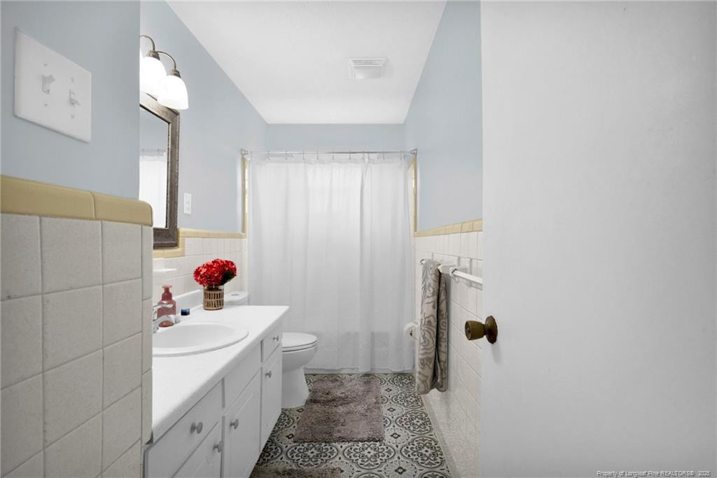 623 Isaac Weeks Road Clinton, NC 28328 - Photo 16 of 24 a bathroom with a sink toilet and shower