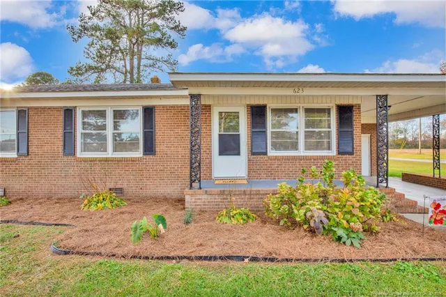 front view of a house with a yard