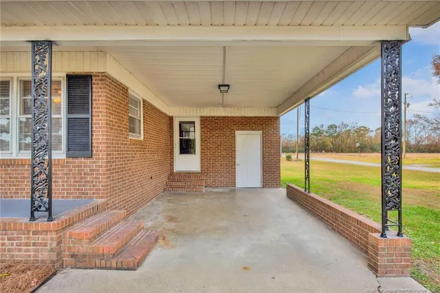 a view of an empty room with a large window
