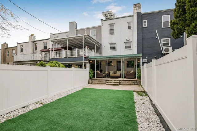 a view of a house with a yard porch and sitting area