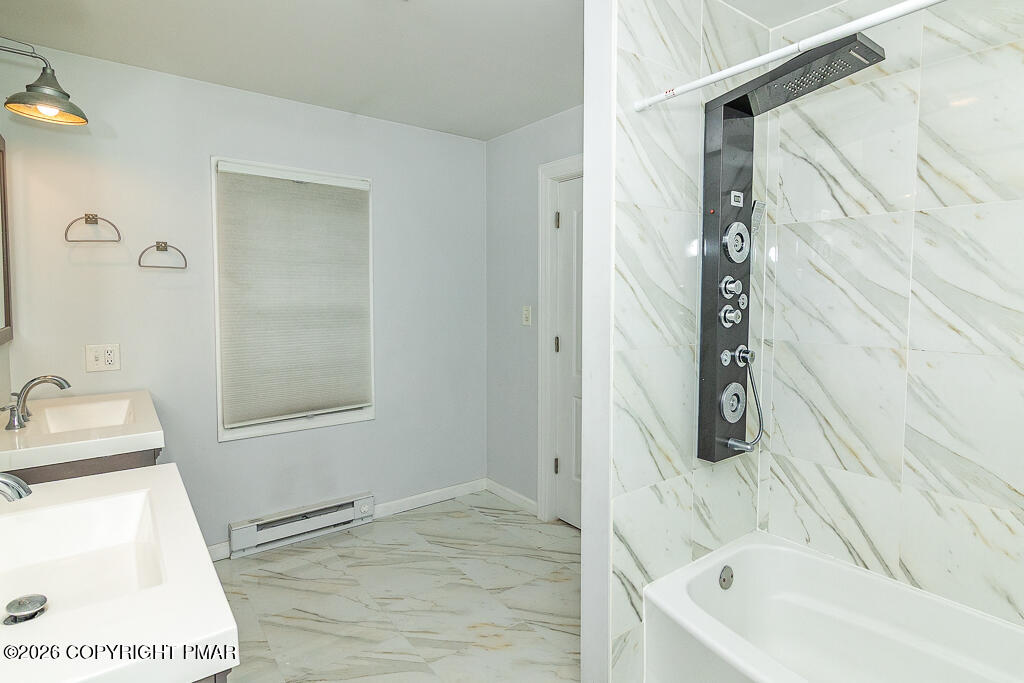 755 White Oak Road Cresco, PA 18326 - Photo 23 of 50 a bathroom with a tub a sink and a shower