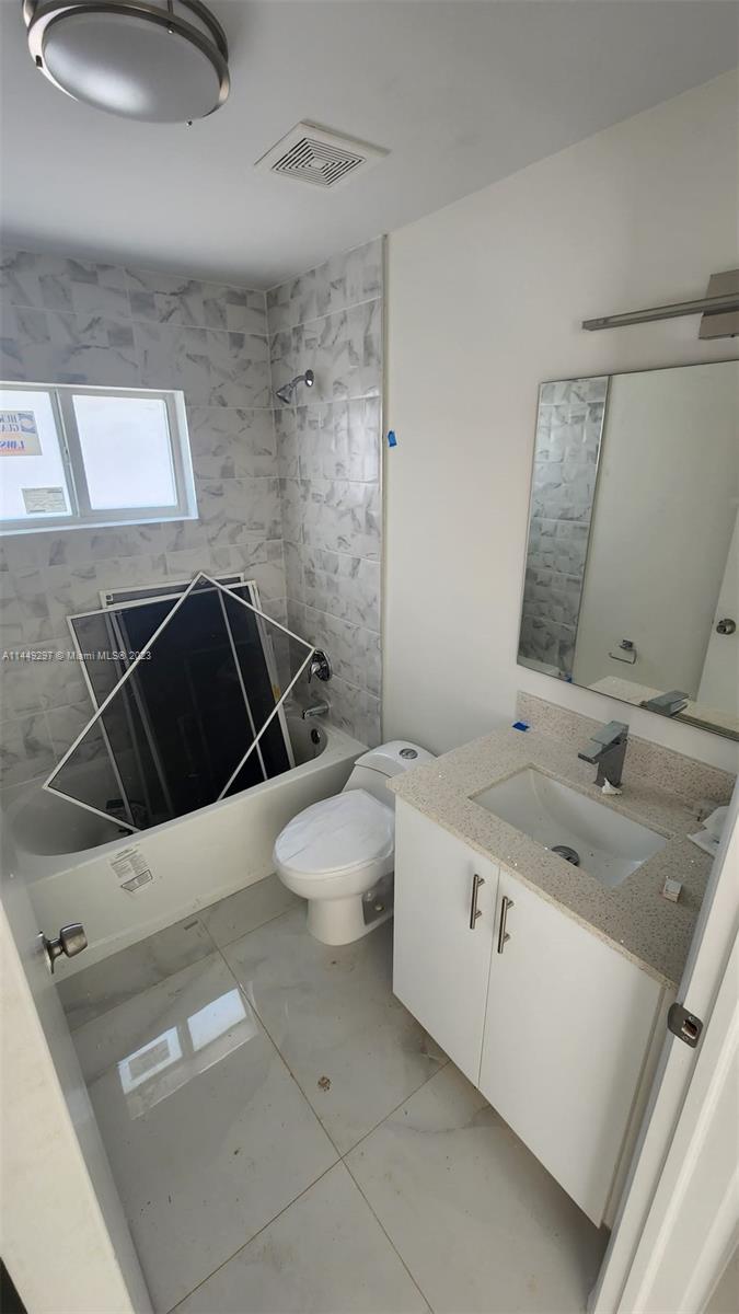 Miami-Dade County Miami, FL 33170 - Photo 14 of 23 a bathroom with a sink and mirror