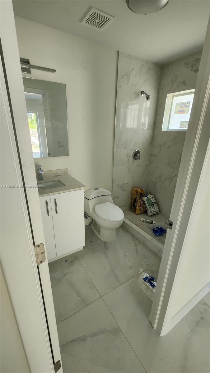 Miami-Dade County Miami, FL 33170 - Photo 19 of 23 a bathroom with a sink a toilet and shower