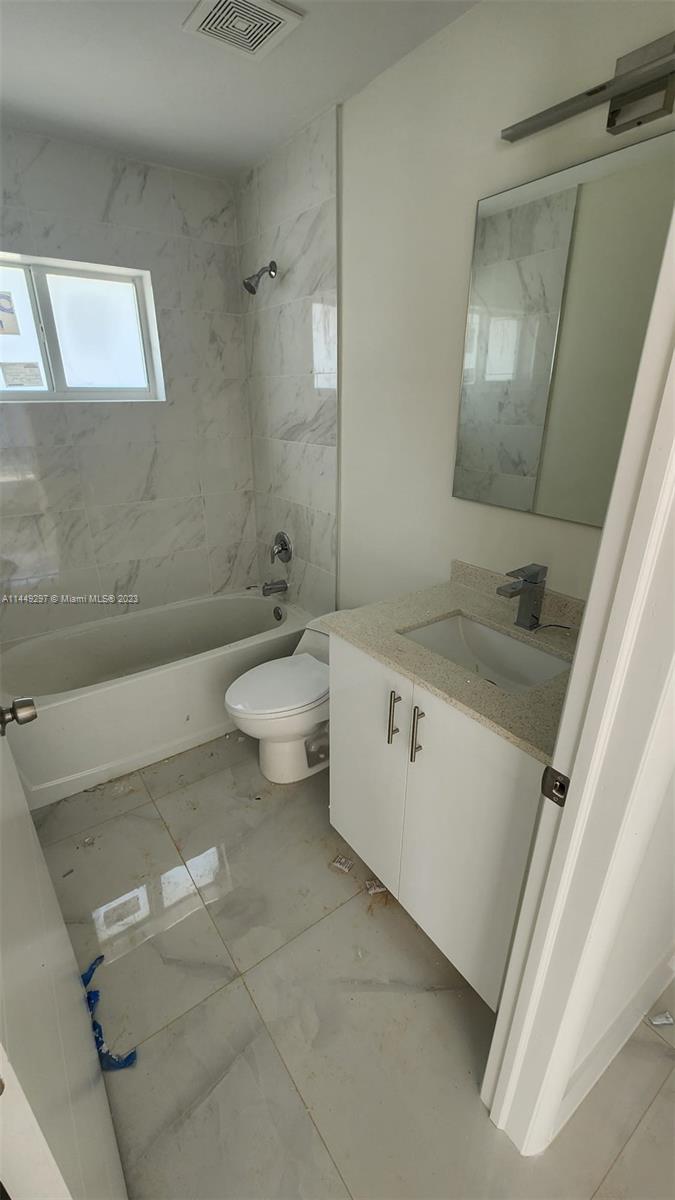 Miami-Dade County Miami, FL 33170 - Photo 20 of 23 a bathroom with a sink a toilet and shower