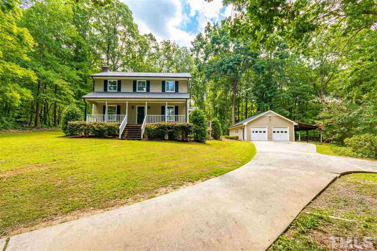 1022 Dove Ridge Road Bahama, NC 27503 - Photo 3 of 27 a view of a house with a swimming pool