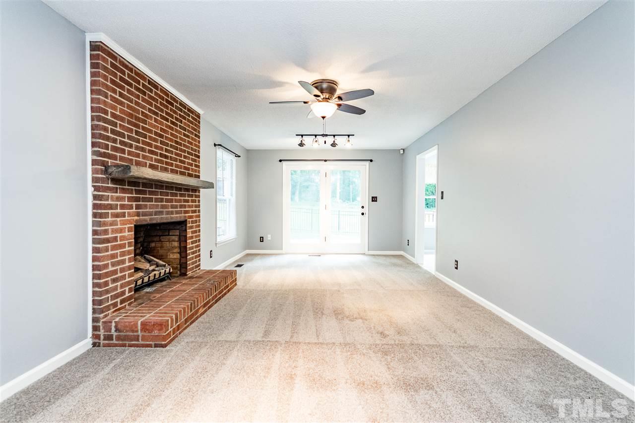 1022 Dove Ridge Road Bahama, NC 27503 - Photo 4 of 27 a view of a livingroom with a fireplace and window