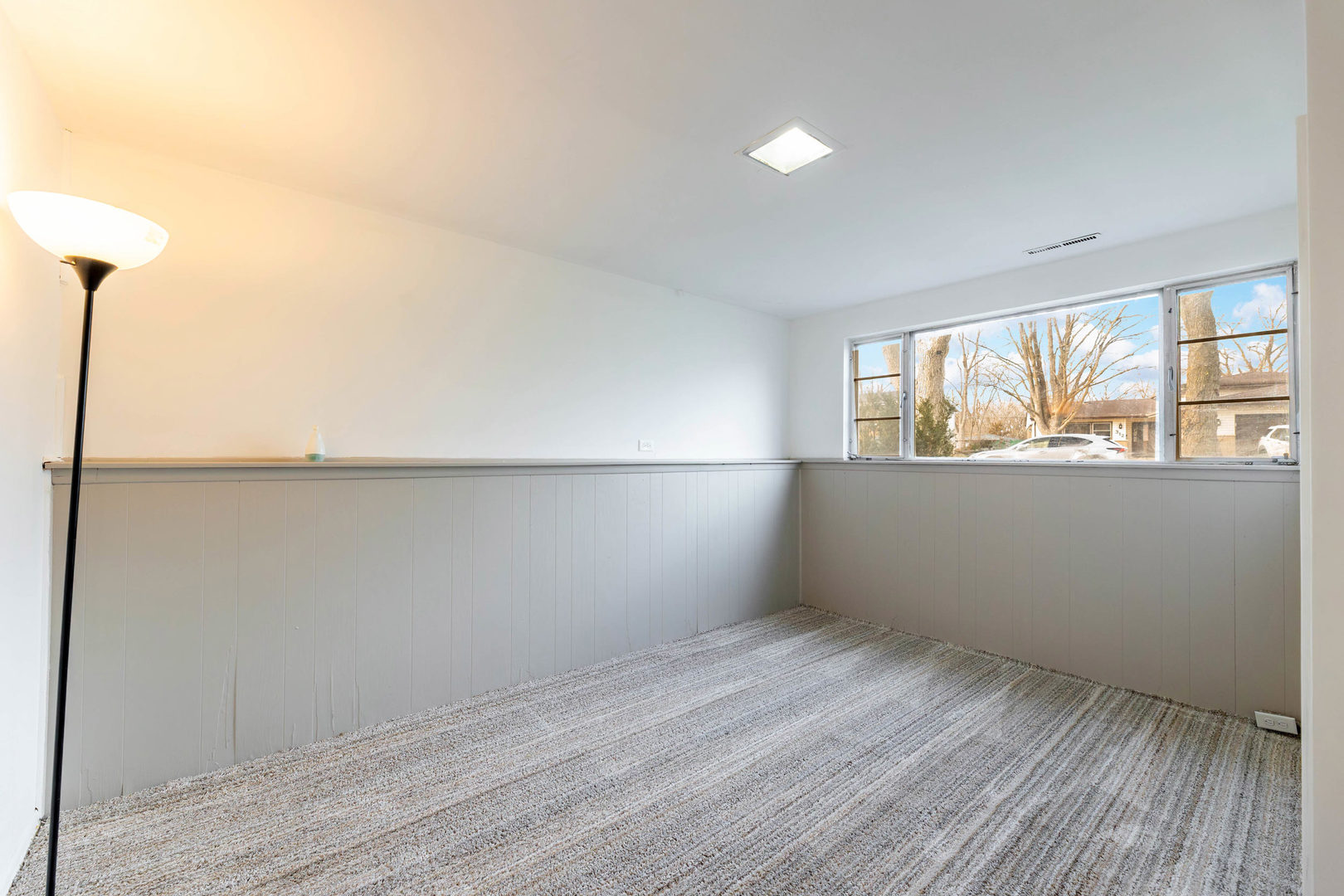 313 Jackson Street Park Forest, IL 60466 - Photo 16 of 22 an empty room with wooden floor and windows