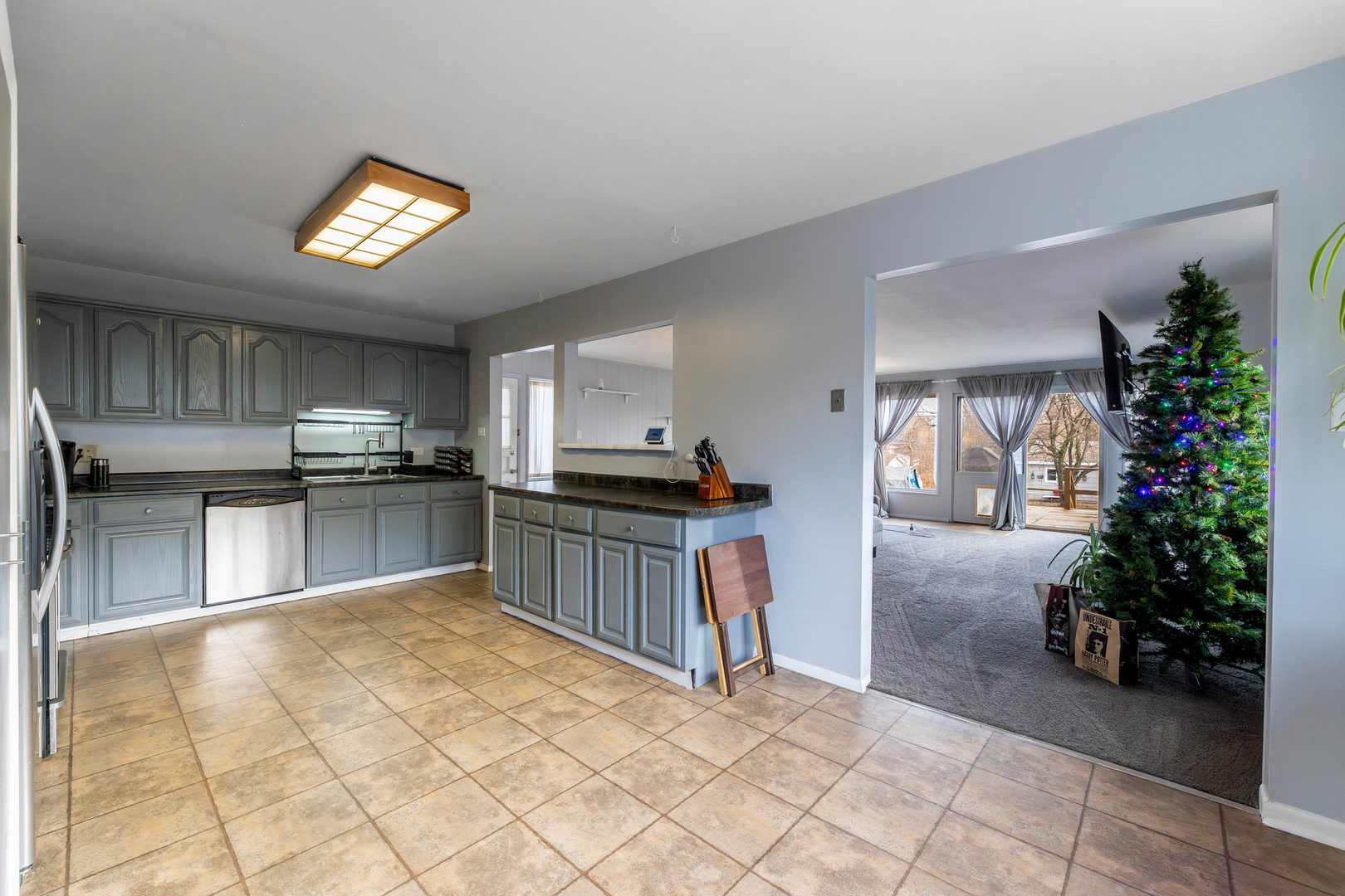 313 Jackson Street Park Forest, IL 60466 - Photo 4 of 22 a kitchen with granite countertop a refrigerator and a stove top oven