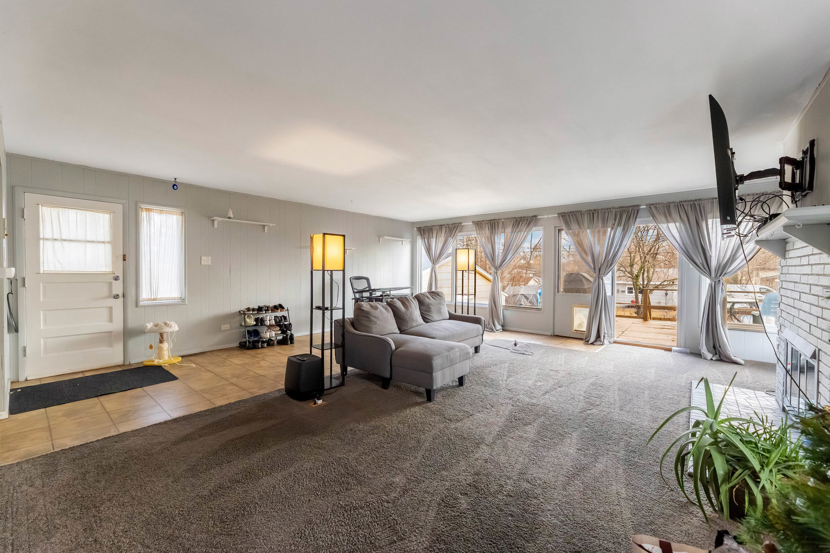 313 Jackson Street Park Forest, IL 60466 - Photo 6 of 22 a living room with furniture and a large window